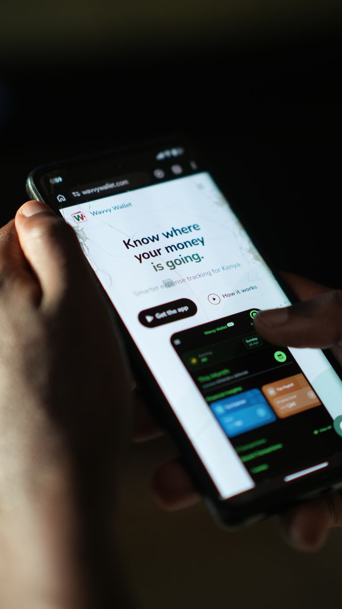 Close-up of a smartphone displaying a money tracking app interface.